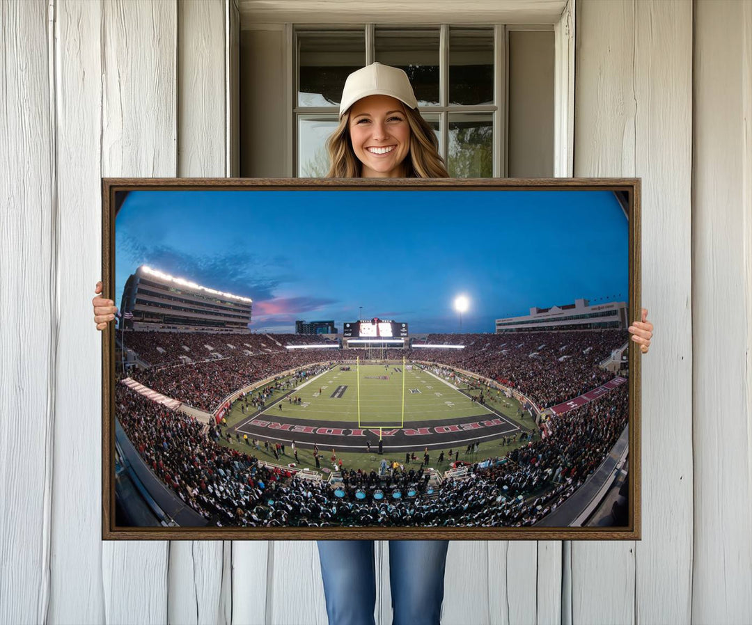 The wall art in the living room features a Texas Tech Red Raiders Football Team Print, showcasing Jones AT&T Stadium at dusk.