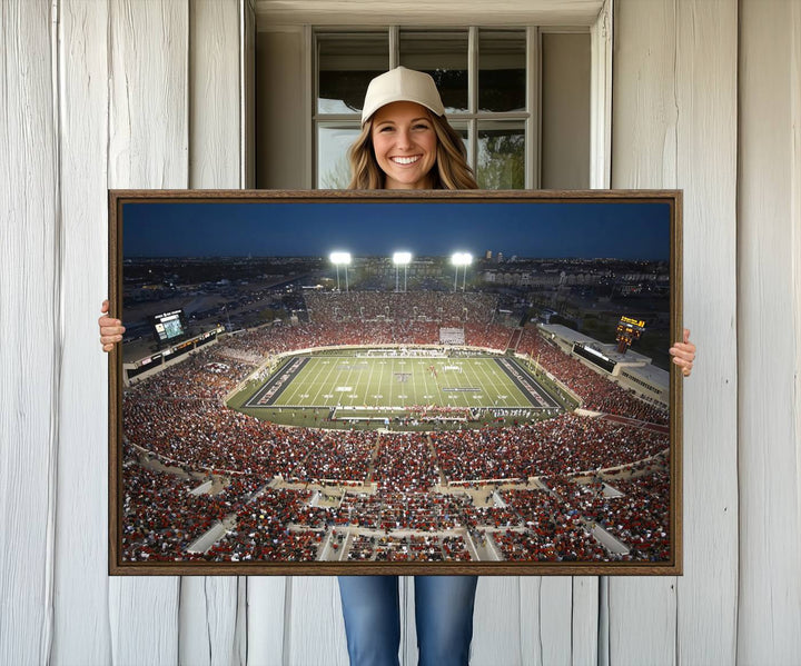 Canvas wall art featuring an aerial view of the Texas Tech Red Raiders packed night game at Lubbock’s Jones AT&T Stadium.