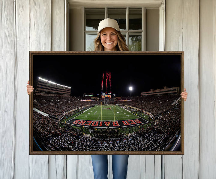 The wall features a Texas Tech Red Raiders Football Team Print on canvas, showcasing fireworks over a packed stadium at night.