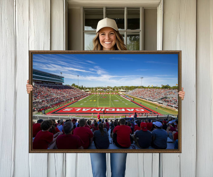 The Ball State Cardinals wall art on canvas depicts fans in red at Scheumann Stadium.