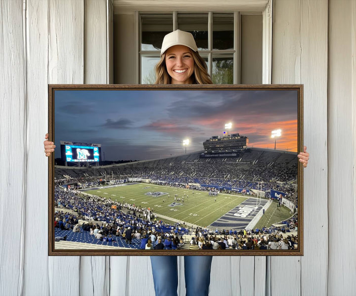 A Memphis Tigers football canvas print of Simmons Bank Liberty Stadium at sunset enhances the living room.