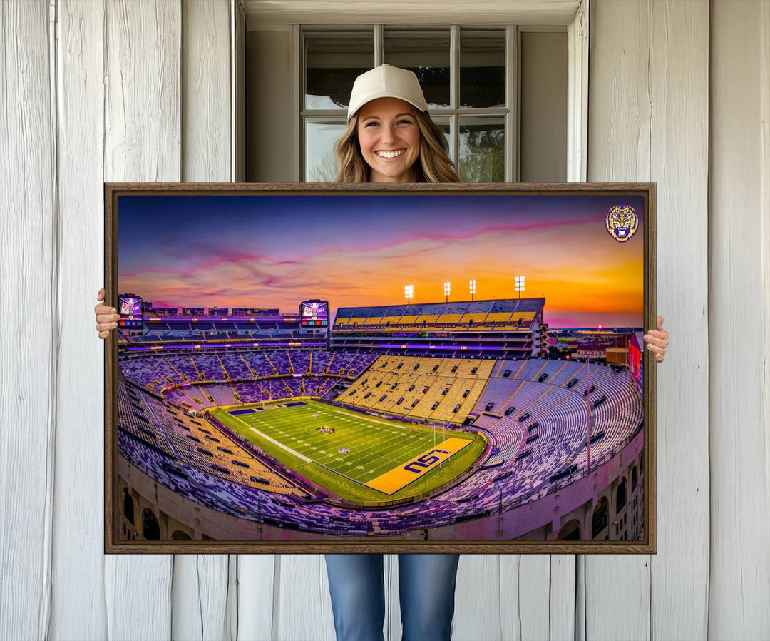 A canvas print of Tiger Stadium at sunset, depicting an empty field and stands, adorns the wall.