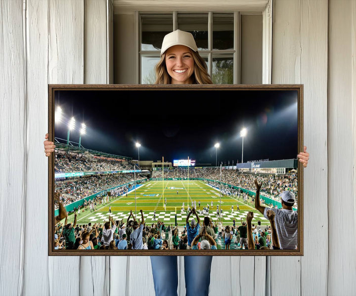 This vibrant wall art canvas print captures the excitement of fans cheering for the Tulane Green Wave Football Team under the lights of Yulman Stadium.