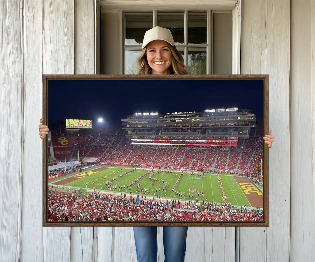 Canvas print depicting a packed stadium at night with a marching band forming USC, celebrating the Trojans at Los Angeles Memorial Coliseum.