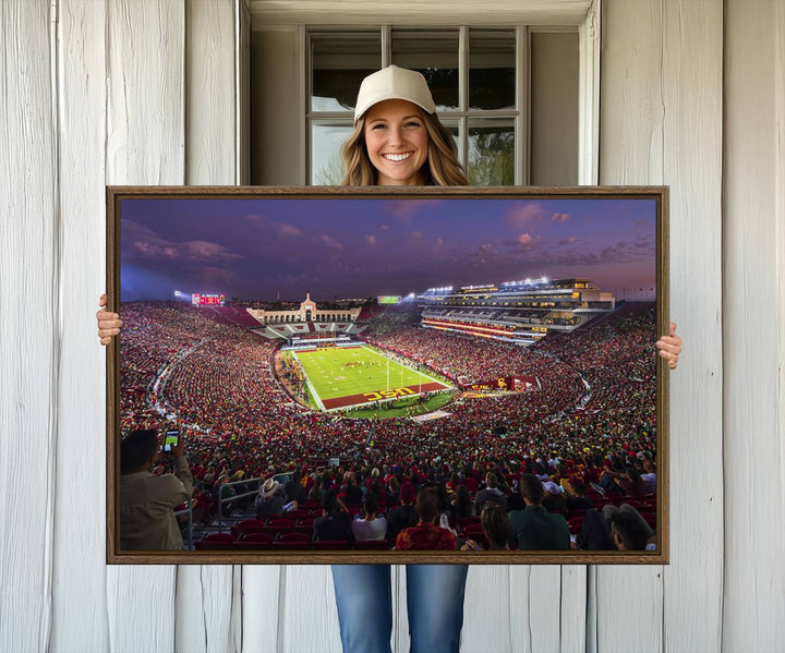 The vibrant wall art canvas print captures the USC Trojans playing under lights at dusk in LA Memorial Coliseum.