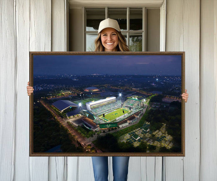 The USF Bulls Football Team Wall Art Canvas Print showcases the Tampa USF Football Stadium at night with city lights.