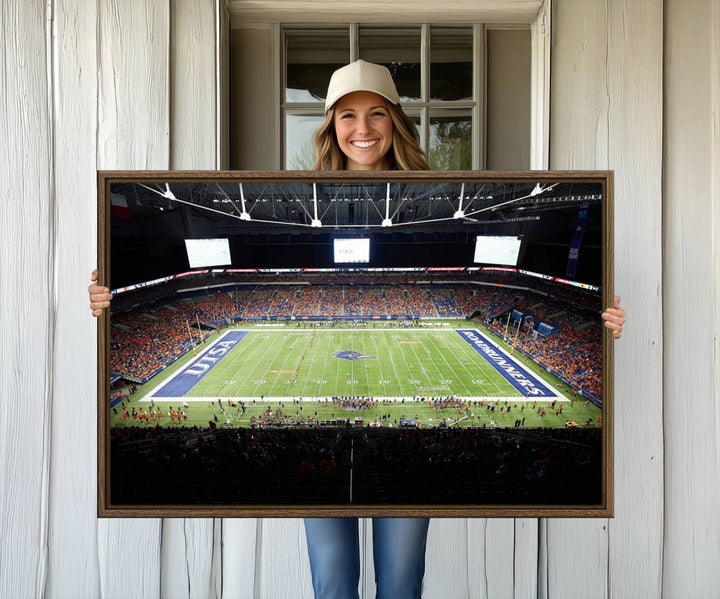 The UTSA Roadrunners game at Alamodome canvas print captures the scene from above, displaying fans and the UTSA lettering on the field.