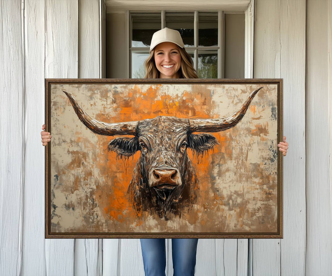 Abstract Cow Longhorn Bull Wall Art presents a detailed face centered on a textured orange and beige background.