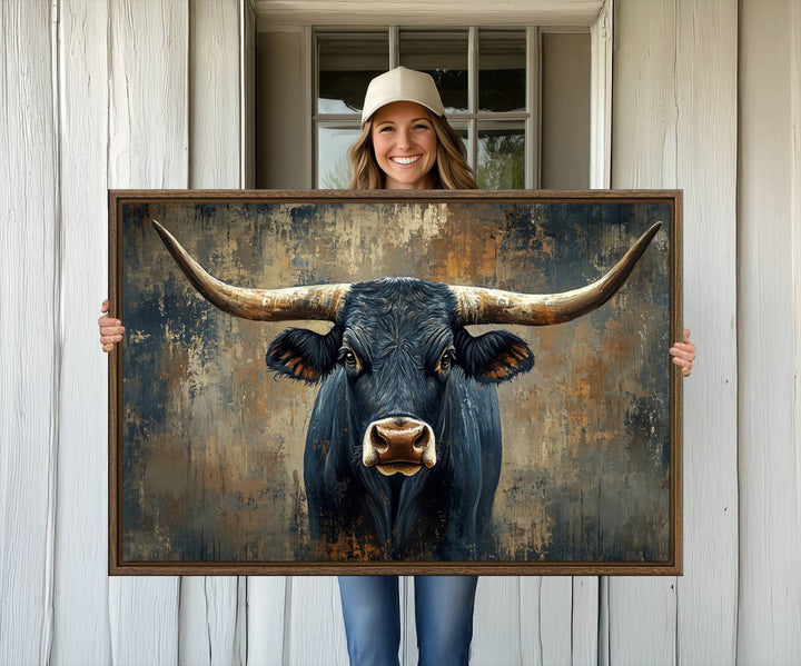 The Texas Western Wall Art Canvas Print showcases a Longhorn Bull set against an abstract brown and gray backdrop, making it perfect for rustic decor.