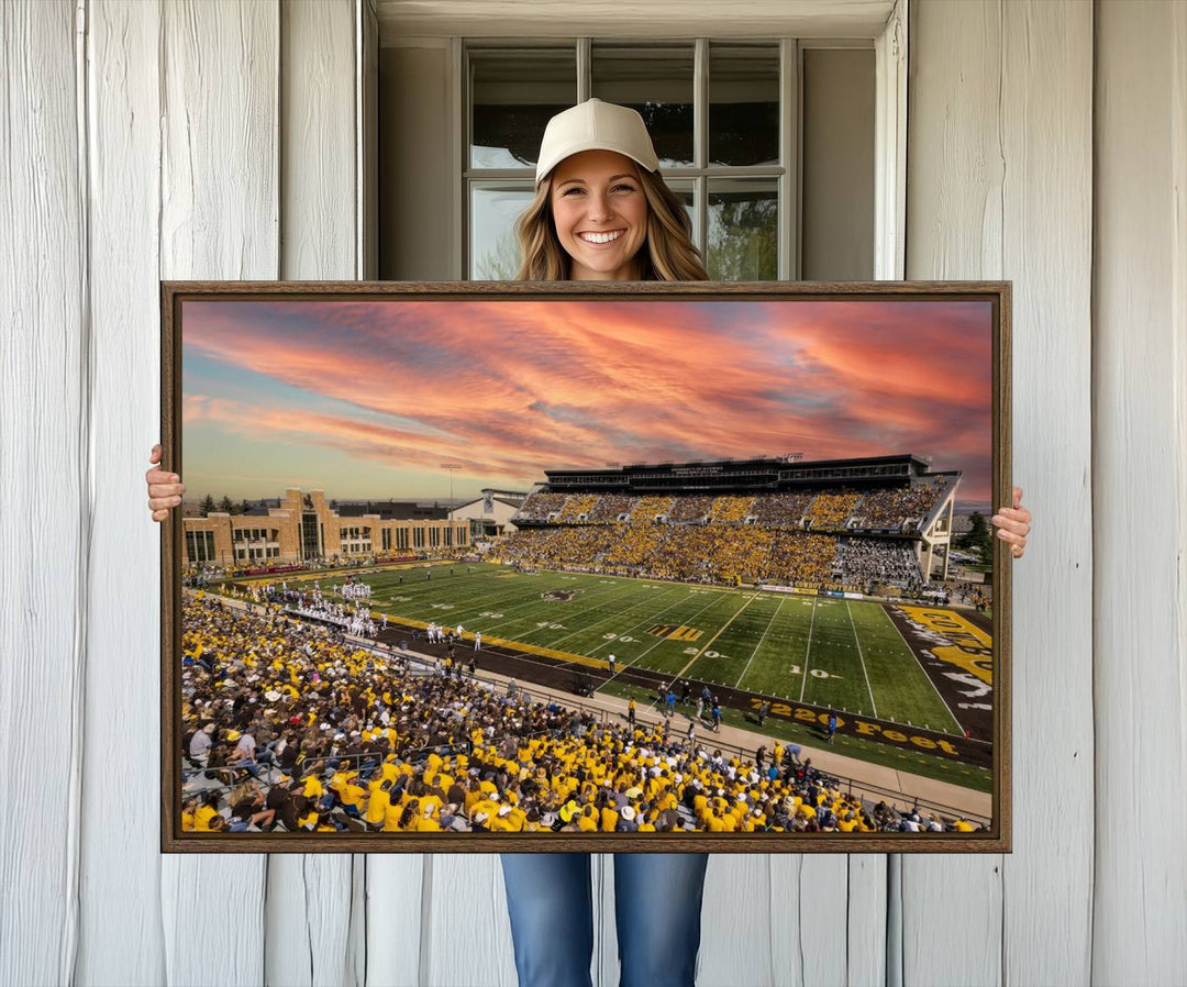 Capture the essence of a packed War Memorial Stadium at sunset with the Cowboys Football Canvas Print, highlighting fans cheering in yellow.