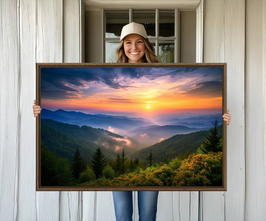 The Majestic Mountain Sunrise Print features a vibrant sky, layered hills, and evergreens, making it a stunning piece of wall decor.