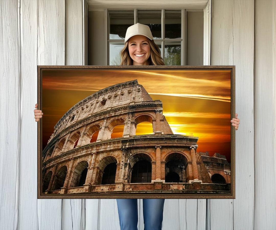 On the wall, theres a piece of art titled Colosseum with Yellow Sunset Behind, Italy.