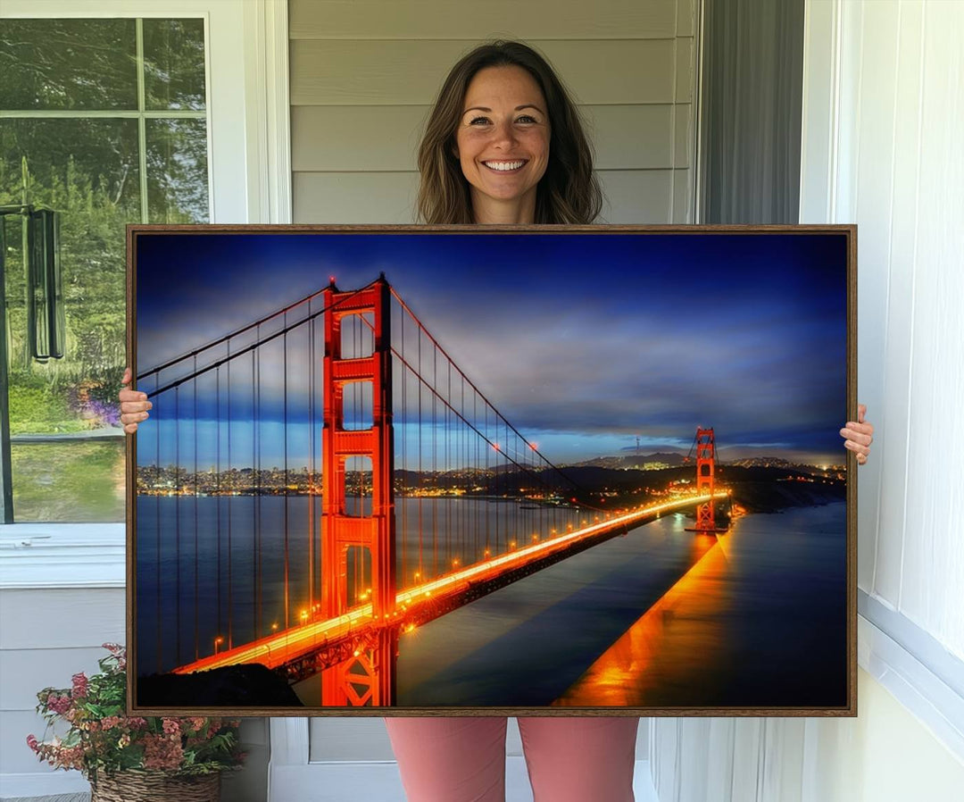 A large wall art San Francisco canvas print of the Golden Gate Bridge at twilight is displayed on a porch.