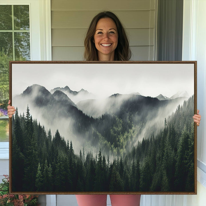 The Misty Forest Canvas Print Wall Art captures a serene misty forest scene with fog and mountains.