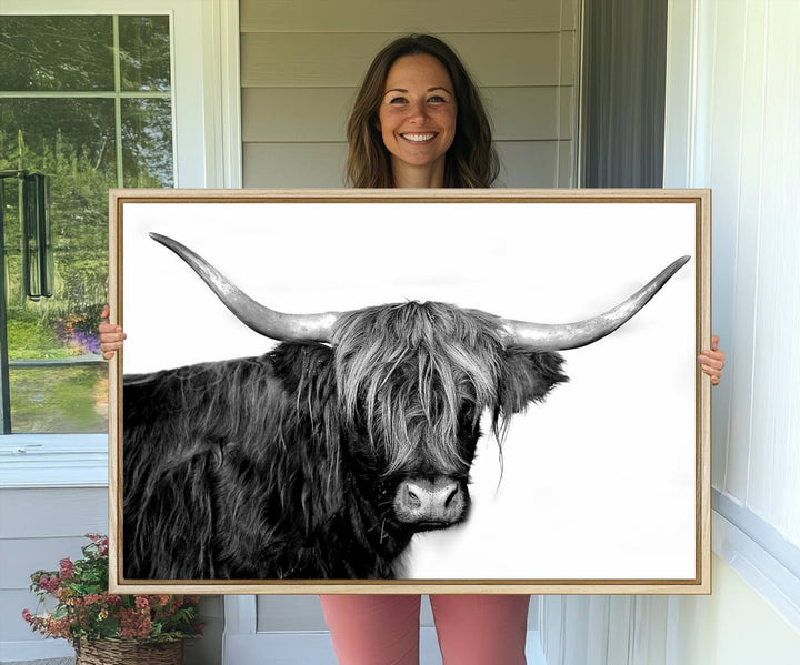 The Black and White Highland Cow Multi Panel Wall Art Canvas Print with UV-protection hangs prominently.