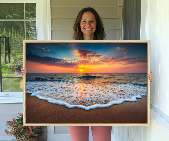 A Sunset with Calm Waves on the Beach Wall Art Canvas Print adorns the dining room.