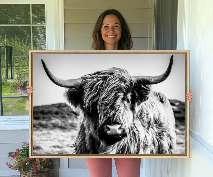 A Black and White Scottish Cow Canvas Print adorns the kitchen wall, perfect for farmhouse decor.