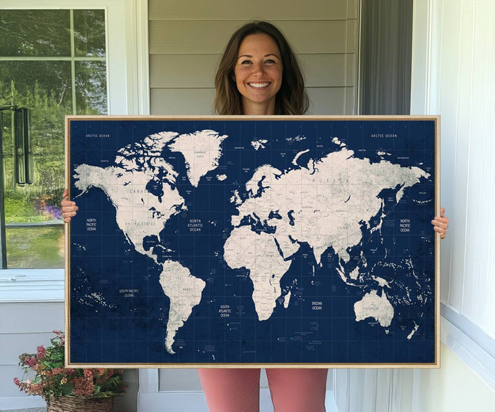 Large modern world map wall art canvas print in beige and navy; showcases a 3-panel vintage map design and is ready to hang.