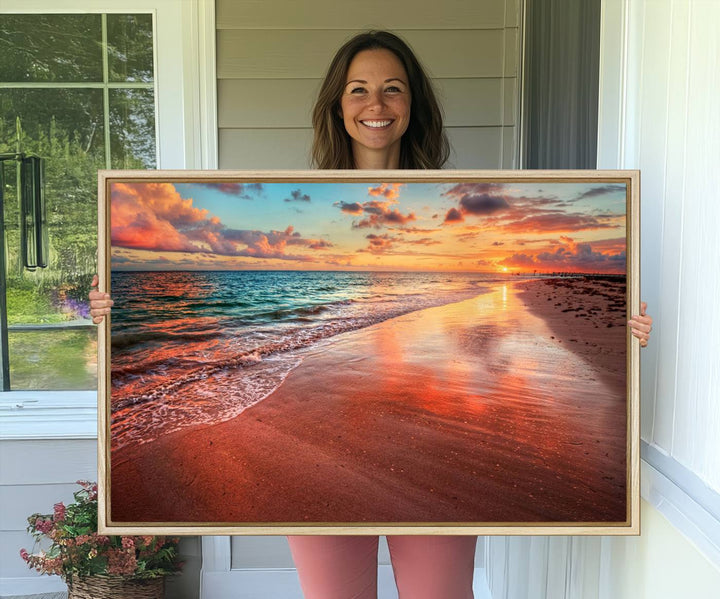 A Vibrant Sunset Beach Canvas Print with ocean waves and sandy shoreline enhances coastal-themed interiors.