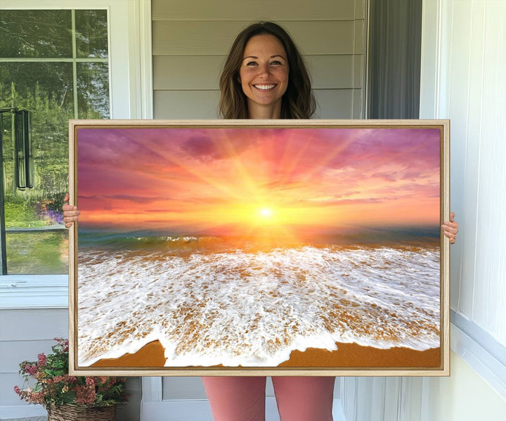 Golden Beach Sunrise 3-panel canvas art of ocean waves, hung on a wooden wall.