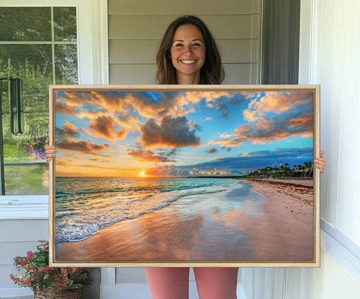 A wall displays Sunset Ocean Waves on Tropical Beach 3-panel canvas art.