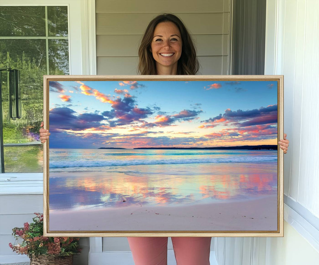 The Tranquil Pastel Sunset Beach Triptych Canvas Art hangs, showcasing its serene beauty.