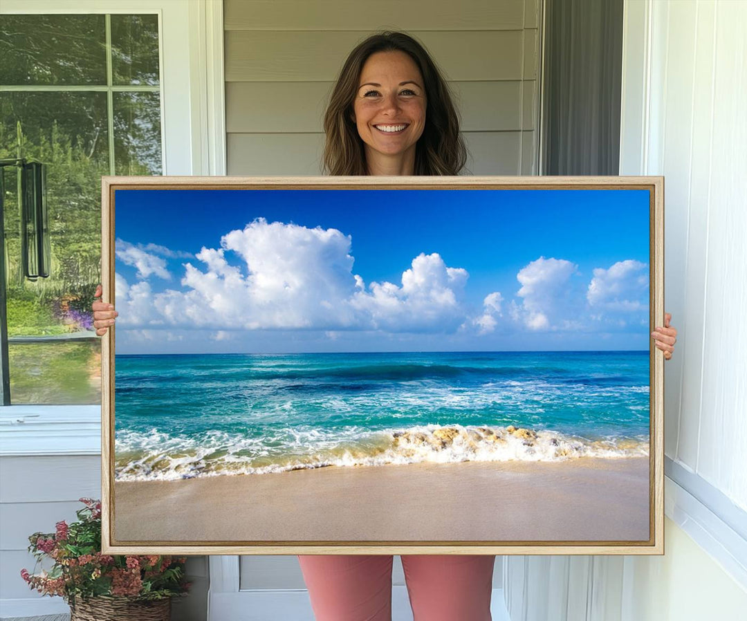 The Tropical Beach 3-Panel Canvas Wall Art features ocean waves gently lapping on a beach under blue skies, making it an ideal choice for coastal decor.