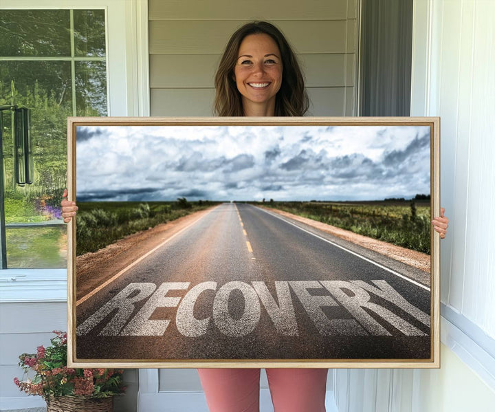 The Recovery Road Wall Art Canvas Print depicts a road under a cloudy horizon.