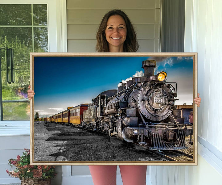 The Train Wall Art Canvas Print features a vintage steam train with a bright headlight.