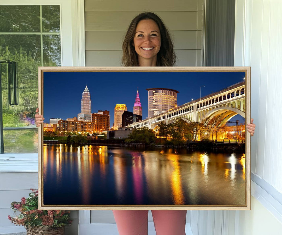 Cleveland Night Skyline Canvas: Cityscape with an illuminated bridge reflecting on calm water.