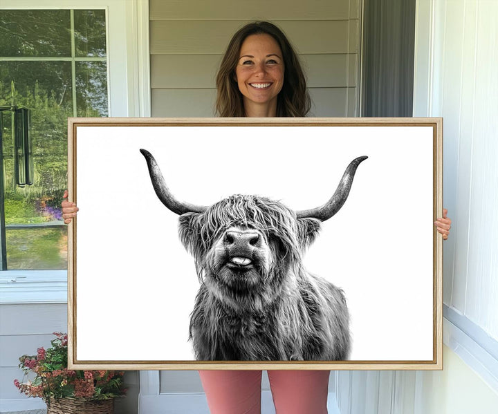 The Fanny Highland Cow art print decorates the modern kitchen, featured in black and white.