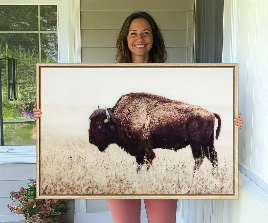 The dining room showcases the Bison in Field canvas print.