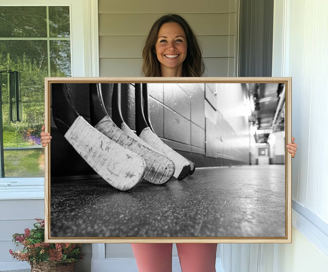 Ice Hockey Wall Art Canvas Print features a UV-protected black and white photo of hockey sticks.