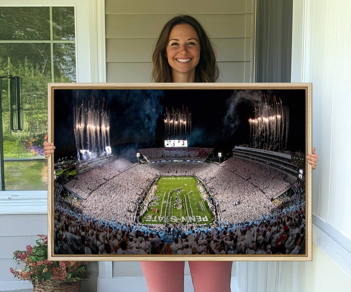 The perfect Penn State Football canvas wall art features a depiction of Beaver Stadium filled with fans in white, with fireworks exploding above.