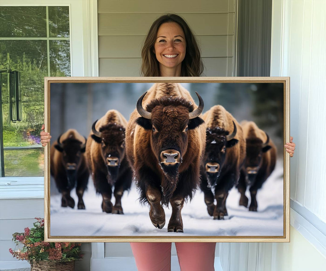 The dining room features an American Bison Herd Canvas Print against the snow.