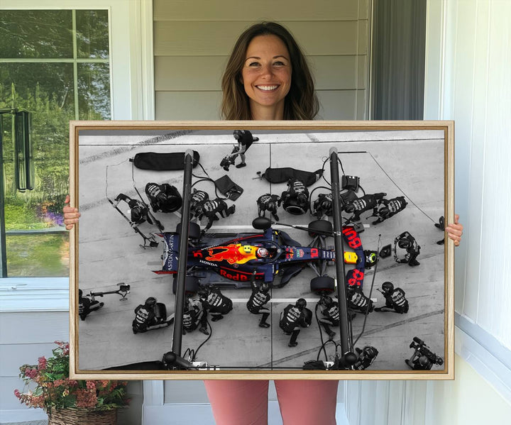 Red Bull Formula 1 Canvas Wall Art Print: An aerial view of a Formula 1 pit stop featuring a Red Bull car on premium canvas.