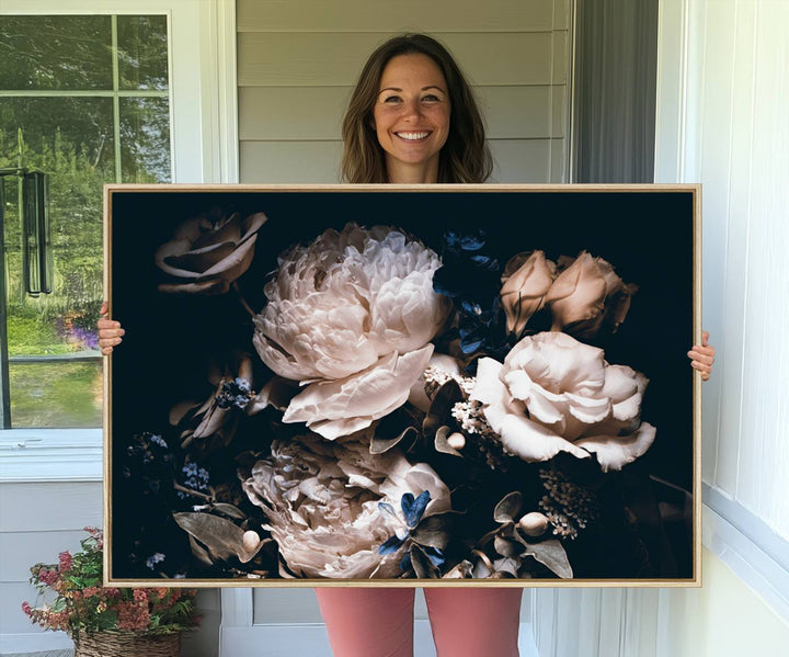 A large canvas art print of pink peonies flowers adds a vibrant touch to the space.