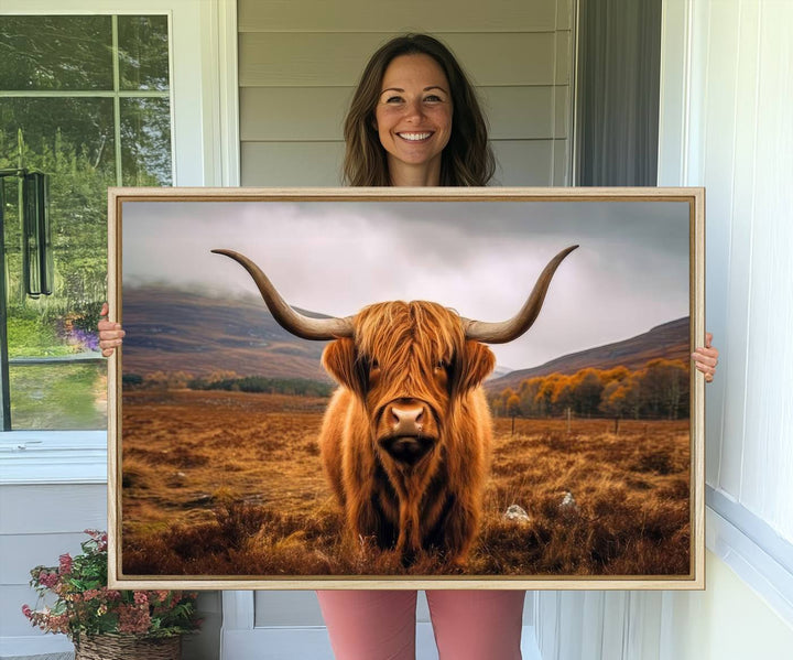 Highland Cow Longhorn Canvas Print, framed, on a wooden wall.