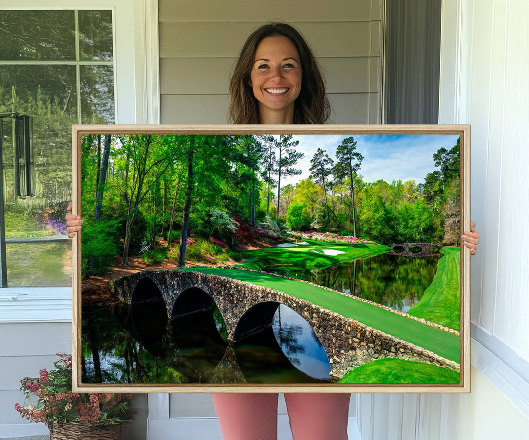 The wall art from Augusta National Golf Club showcases a panoramic bridge set against rich, lush greenery on a framed triptych canvas.