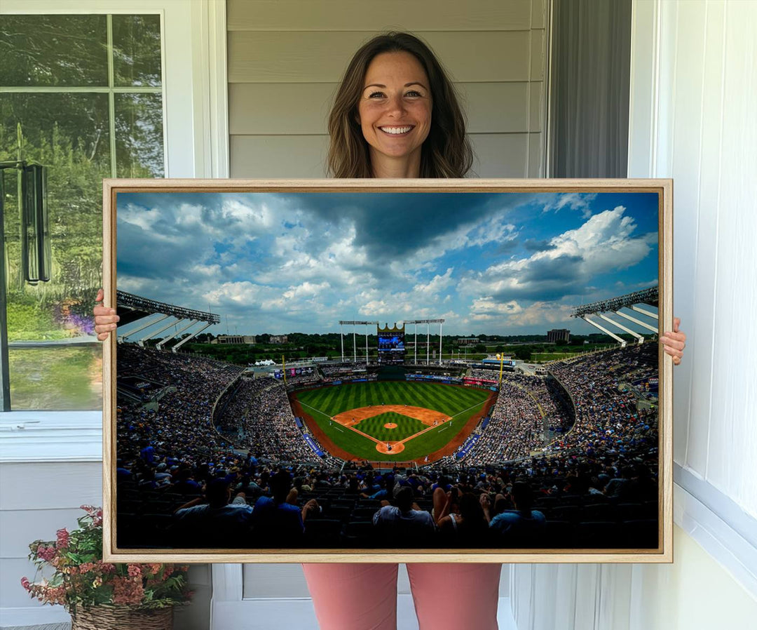 A 3-panel print of Kauffman Stadium, showcasing a crowded baseball field under cloudy skies.