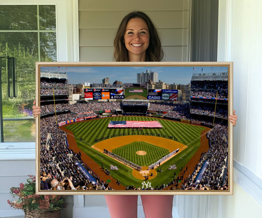 The Yankee Stadium New York wall art print features a vibrant scene of baseball fans with a large flag and players, expertly capturing the spirit of the game. This ready-to-hang décor is perfect for adding a dynamic touch to any space.