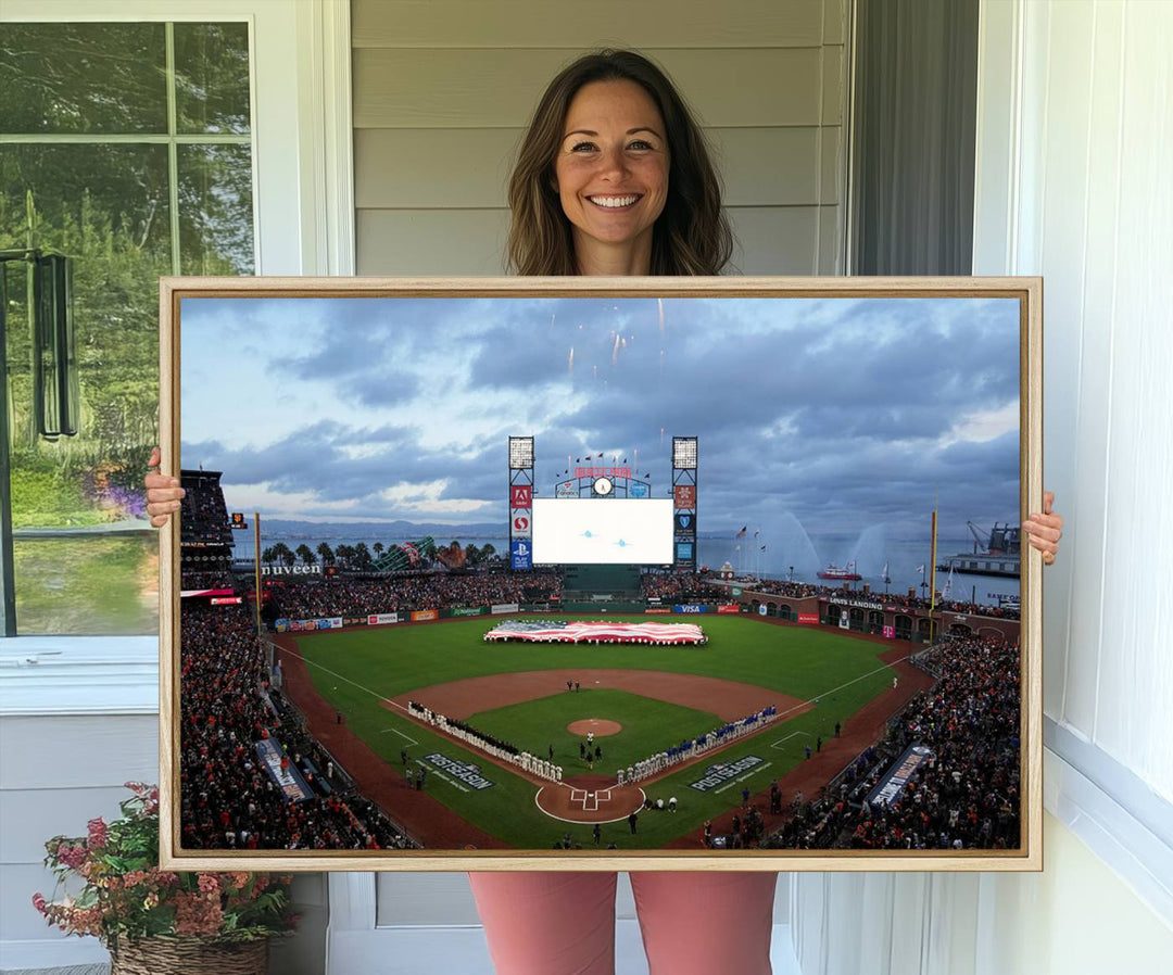 This framed 3-panel canvas MLB wall art features a giant flag and fans under a cloudy sky at Oracle Park.