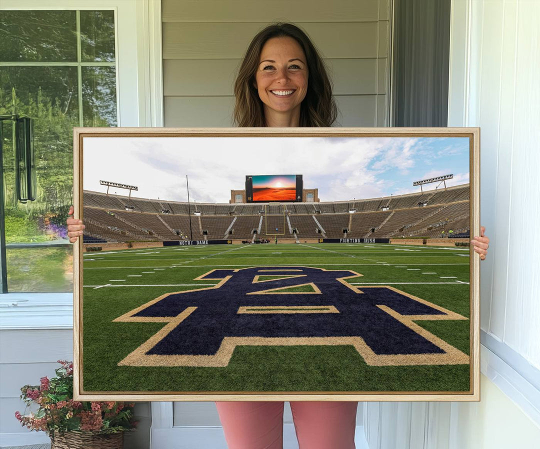 Notre Dame Stadium Triptych: This ready-to-hang giclee canvas print features a vibrant depiction of the football field adorned with an A logo and a stunning sunset.