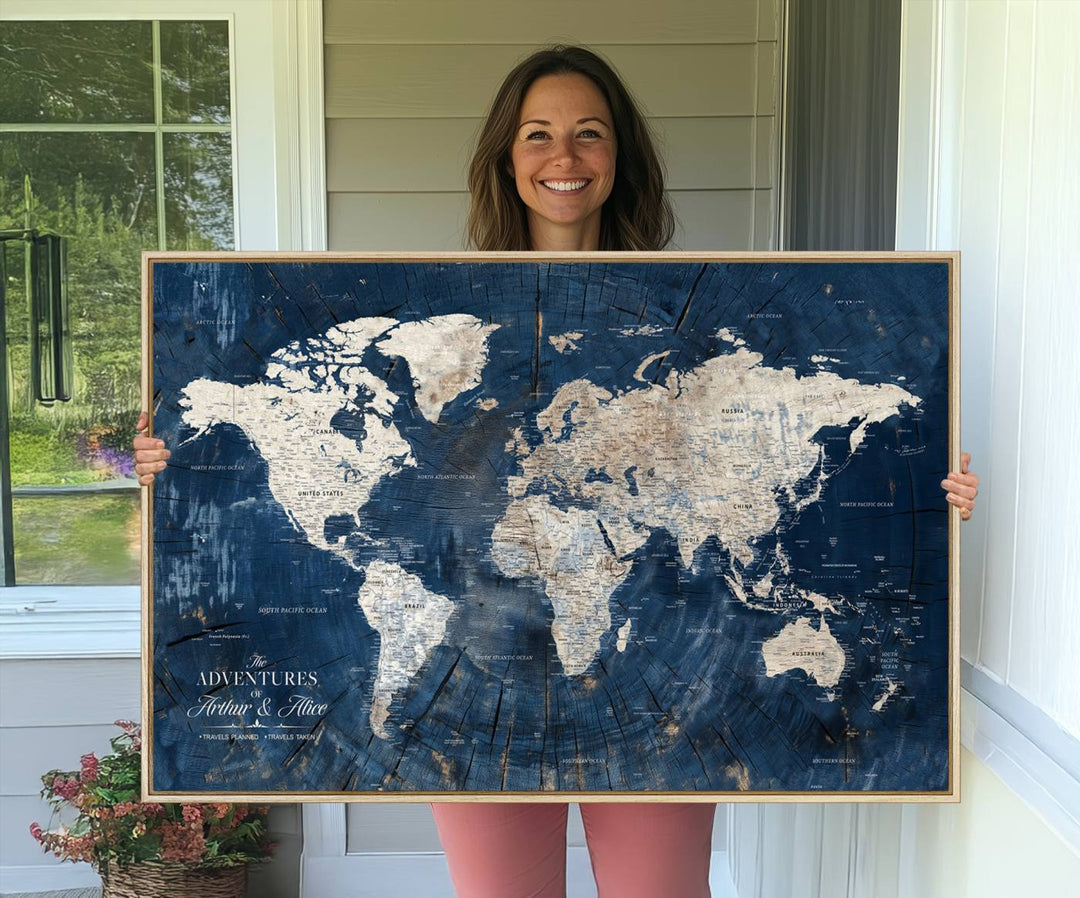 Personalized World Map Wall Art Print is displayed on a porch, with plants in the background.