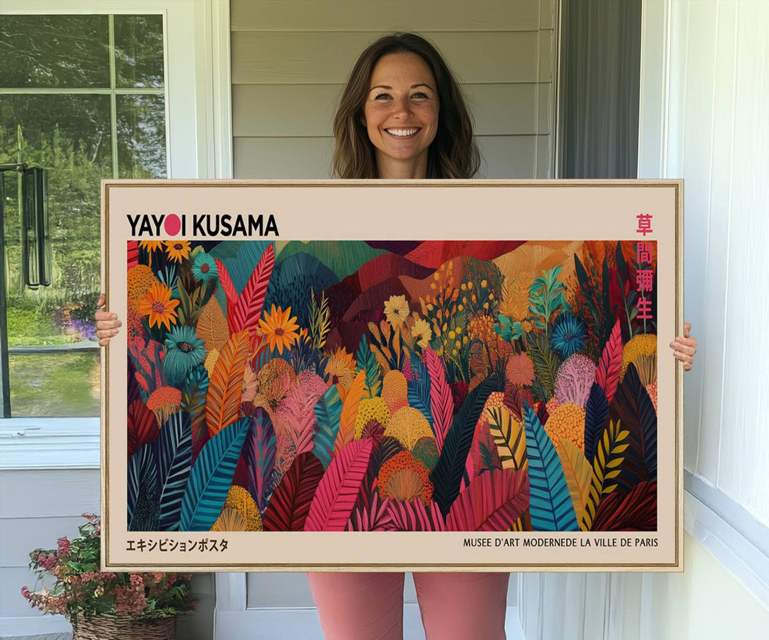 A Yayoi Kusama Wall Art Canvas Print is framed by a window and potted plant.