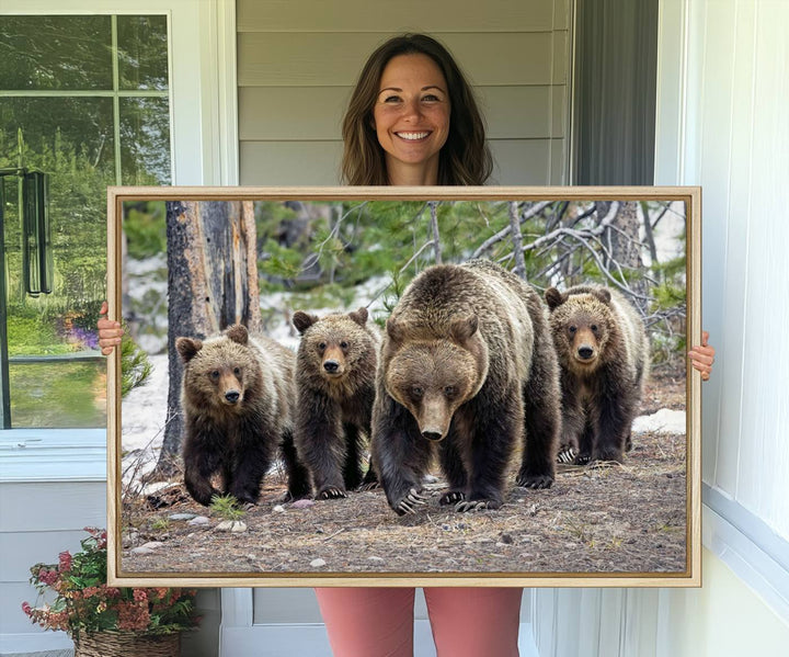 The Grizzly 399 and Cubs in Wild Flowers Wall Art Canvas Print, depicting grizzly bears amidst wildflowers, is elegantly displayed.