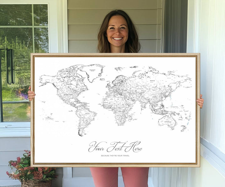 A large Framed Push Pin Mini World Travel Map Wall Art Print features customizable text and is designed as a premium cork pin board canvas with labeled countries for a gallery-quality finish.