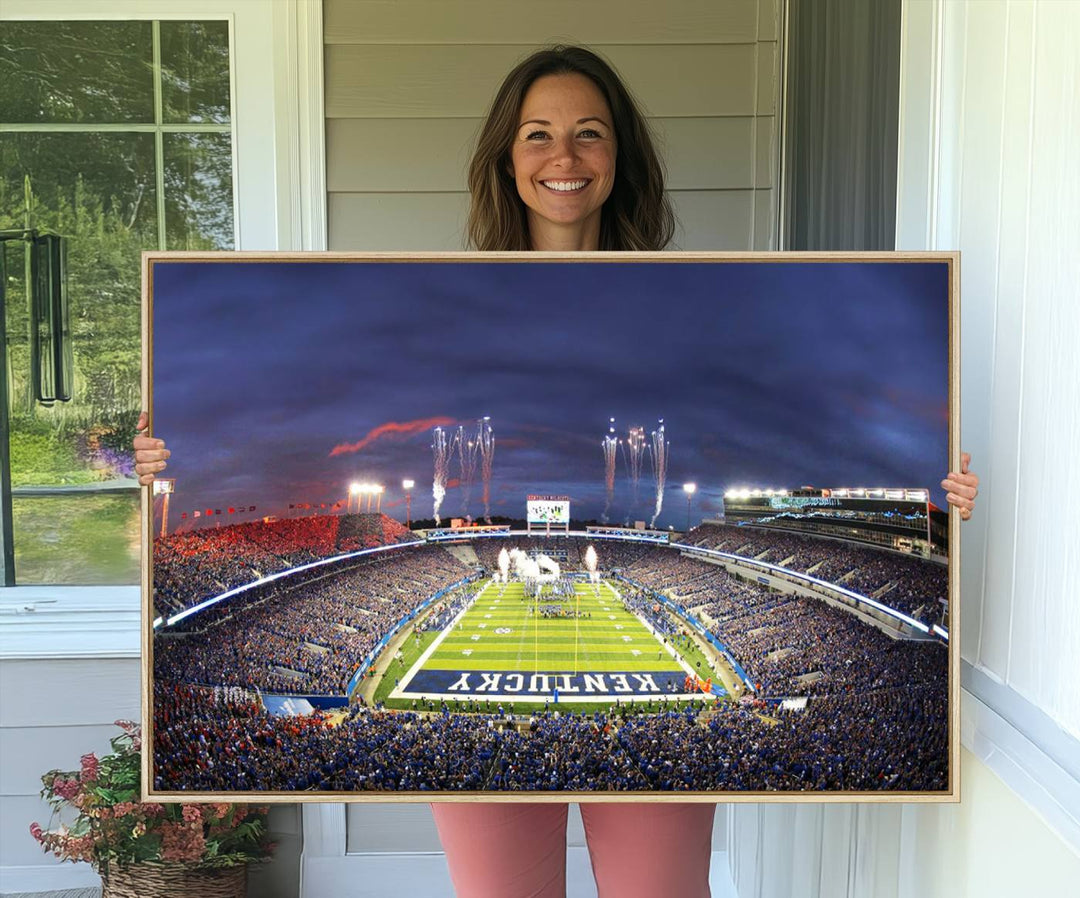 A filled stadium at dusk and fireworks overhead are beautifully captured in the Kroger Field Canvas Wall Art - Sunset Football Stadium Decor.