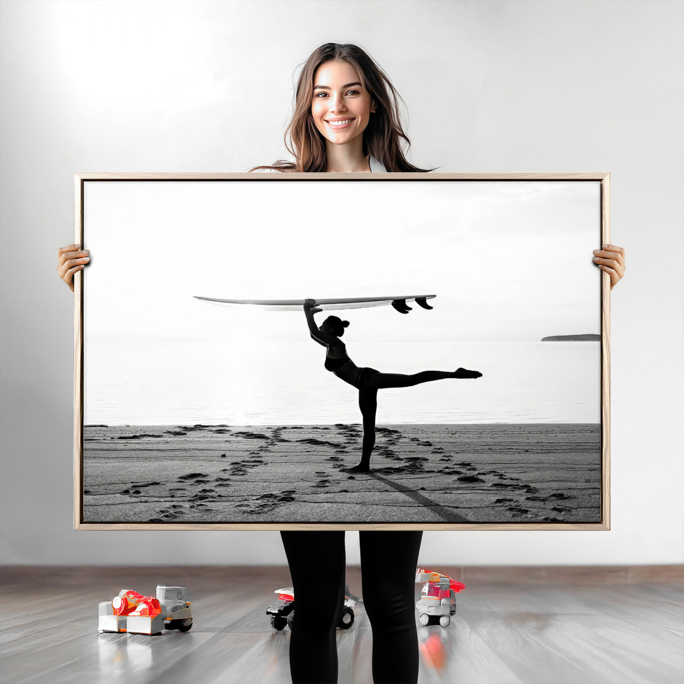 A woman balances a surfboard on her head while striking a yoga pose on the beach, silhouetted against a calm ocean horizon.