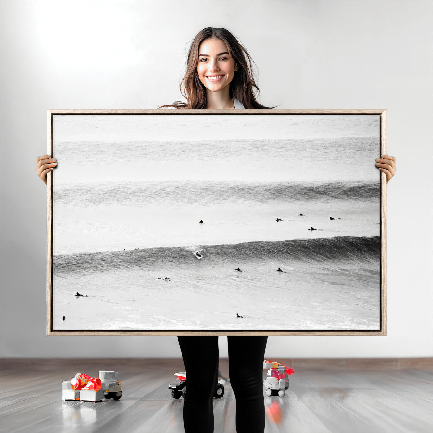 A monochrome photograph of swimmers gliding through gentle ocean waves, evoking a sense of calm and movement.